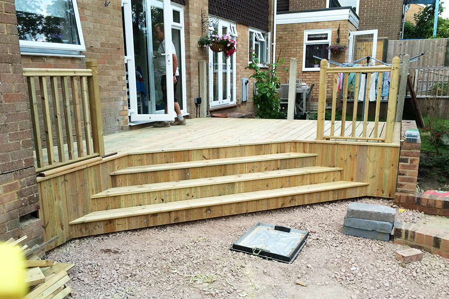Replacement of patio with raised decking